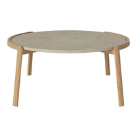 Round coffee table with a light gray stone top and natural wooden legs, featuring a minimalist design.