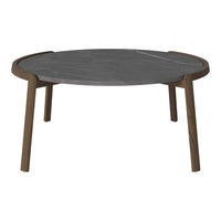 Round coffee table featuring a dark gray marble top and rich brown wooden legs, showcasing a sleek, modern design.