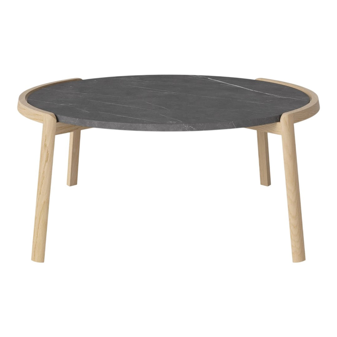 Round black marble coffee table with natural wood legs, featuring a simple and modern design.