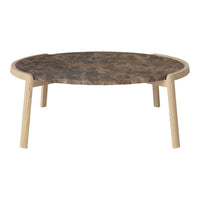 Round coffee table with a dark marble top and light wooden legs, featuring a minimalist design and smooth finish.