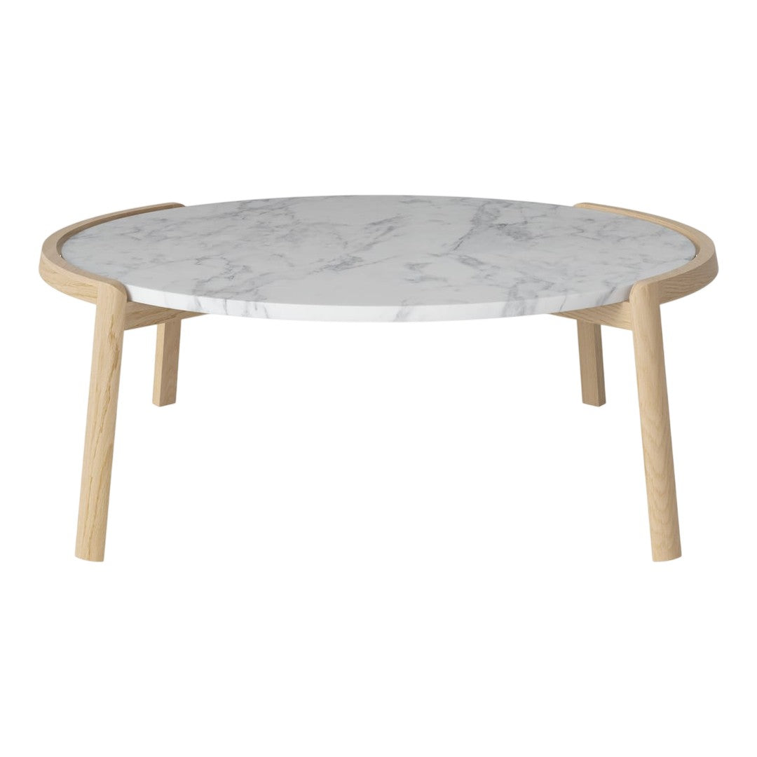 Round coffee table with a white marble top and light wood legs. Elegant marble veining adds subtle sophistication.