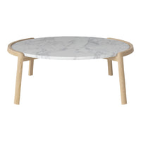 Round coffee table with a white marble top and light wood legs. Elegant marble veining adds subtle sophistication.