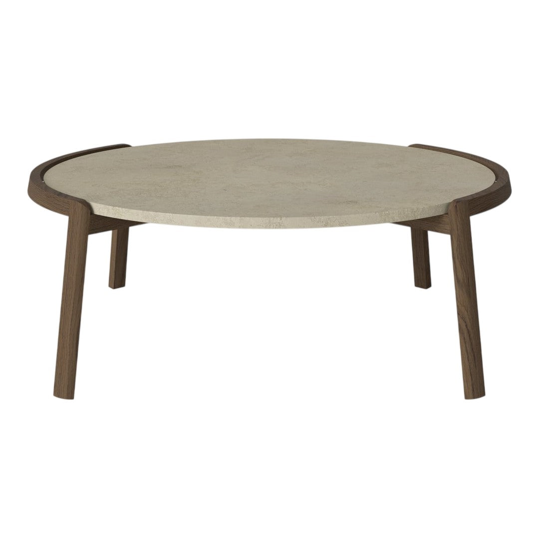 Round coffee table with a smooth beige top and contrasting dark wood legs, featuring a minimalist design.