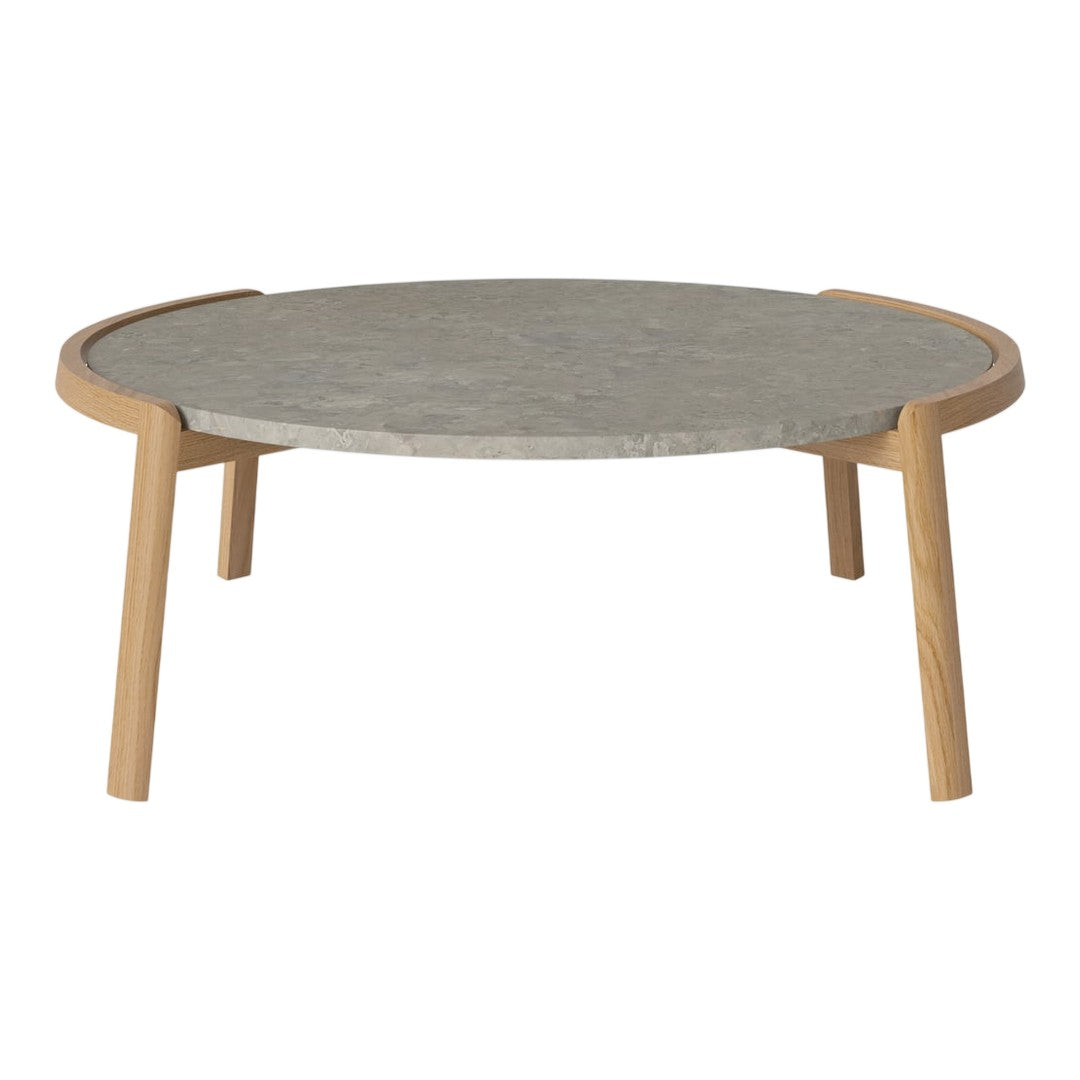 Round coffee table with a gray stone top and natural wood legs, featuring a sleek, modern design.
