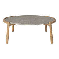 Round coffee table with a gray stone top and natural wood legs, featuring a sleek, modern design.