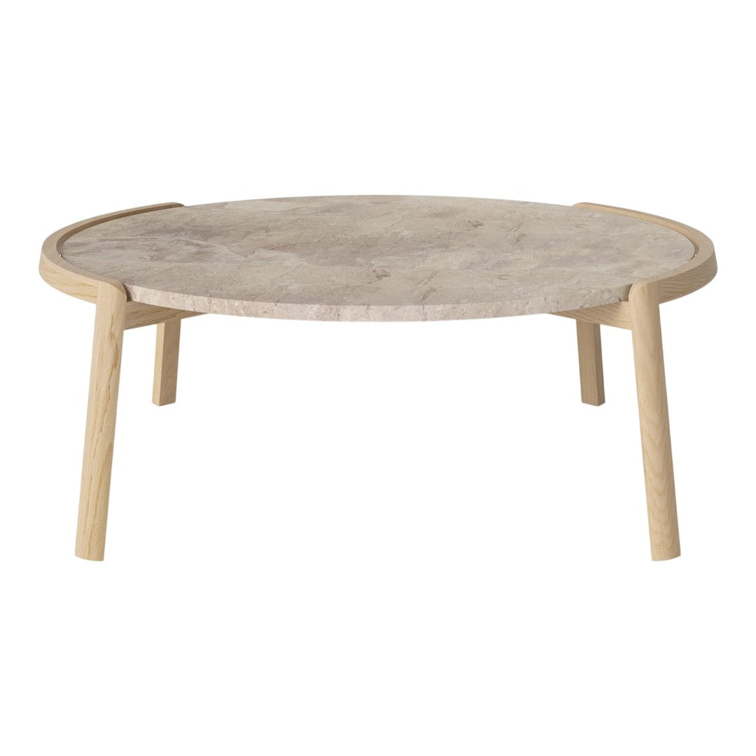 Round coffee table with a neutral marble top and natural wood legs, showcasing a minimalist design and soft tones.