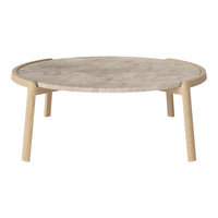 Round coffee table with a neutral marble top and natural wood legs, showcasing a minimalist design and soft tones.
