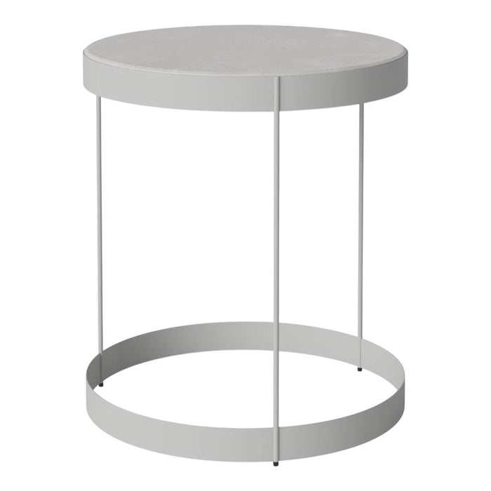 Round gray side table with a sleek metal base and minimalist design, perfect for modern decor.