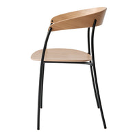 Natural wood and sleek black metal create a modern, minimalist chair with a distinctive curved back design.