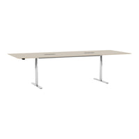 Rectangular table with a light beige surface and sleek chrome legs; minimalist design with a smooth, solid finish.