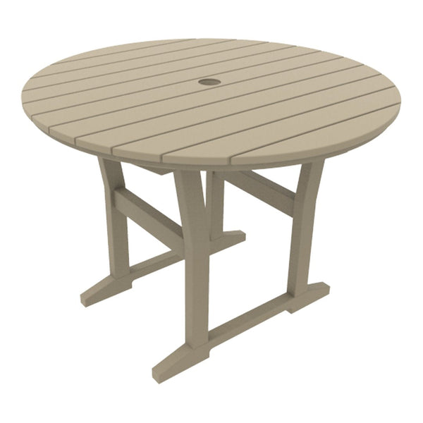 Round taupe outdoor table with a slatted top and sturdy cross legs. Ideal for patio or garden settings.