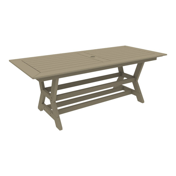 Light taupe outdoor dining table with horizontal slat pattern and a rectangular shape. Perfect for patio setups.