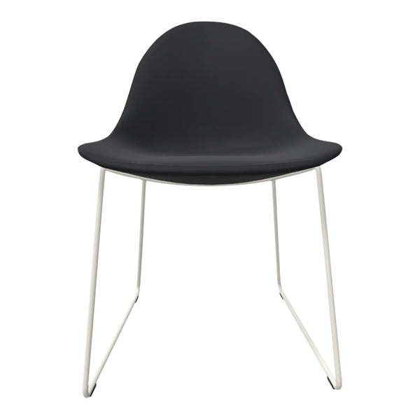 Black chair with a smooth surface and sleek white metal legs, featuring a minimalist design. Perfect for modern decor.