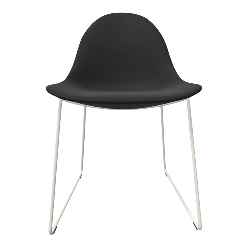Black chair with a smooth surface and sleek white metal legs, featuring a minimalist design. Perfect for modern decor.