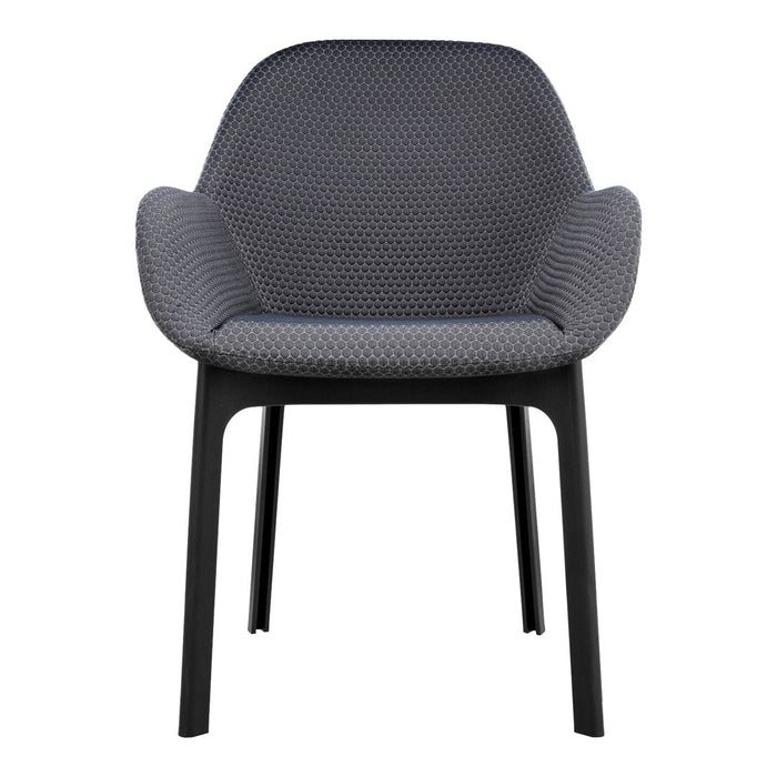 Stylish gray patterned chair with rounded arms and a sturdy black frame, perfect for modern decor.