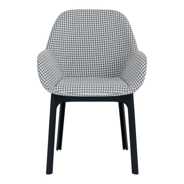 Black and white houndstooth patterned chair with sleek black legs. Modern design for stylish interiors.