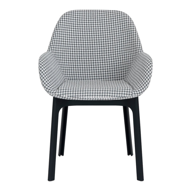 Black and white houndstooth patterned chair with sleek black legs. Modern design for stylish interiors.