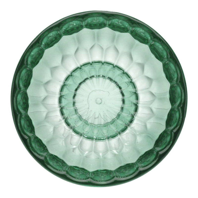 Green glass plate featuring a textured, geometric floral pattern with a scalloped edge.