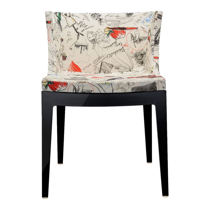 Cream fabric chair with abstract multicolor patterns and black wooden legs. Stylish and modern design for any space.