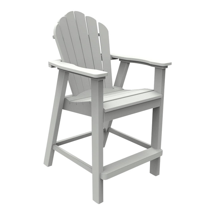 Gray Adirondack chair with a slatted seat and curved backrest, featuring a classic, timeless design.