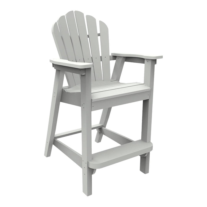 Gray Adirondack chair with a slatted backrest and armrests, perfect for outdoor seating. Classic coastal design.