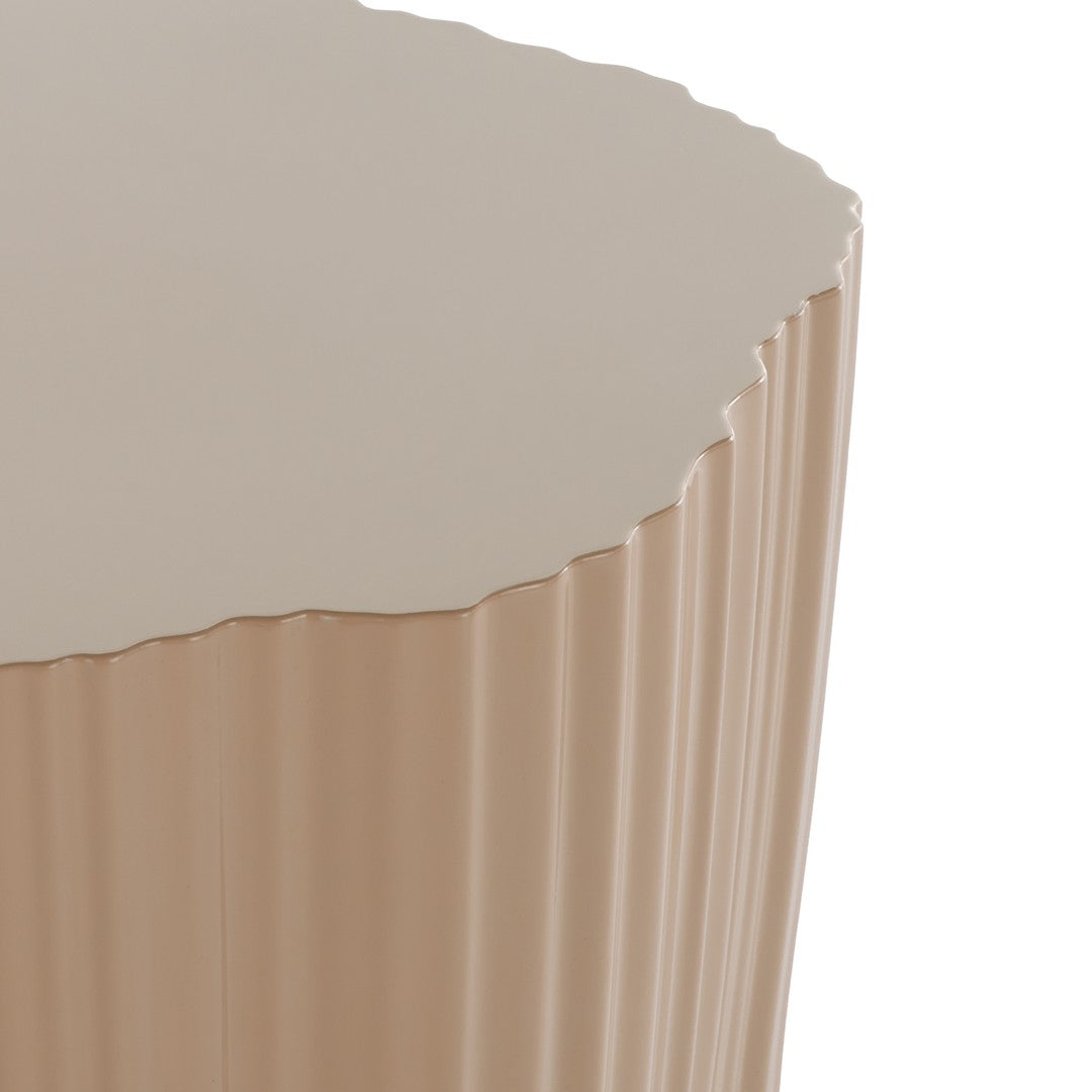 Round beige side table with a textured scalloped edge and smooth taupe top. Perfect for modern decor.