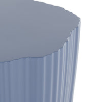 Textured light blue side table with a scalloped edge and ribbed surface pattern, perfect for modern decor.