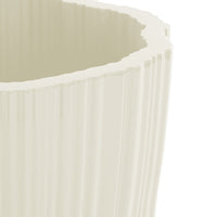 Textured cream planter with a fluted design and a smooth, glossy finish, perfect for enhancing your decor.