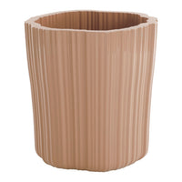 Pale pink ribbed planter with a unique scalloped top edge, ideal for modern decor and indoor gardening.