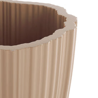 Beige ribbed planter with a scalloped edge, showcasing a smooth finish and elegant texture.