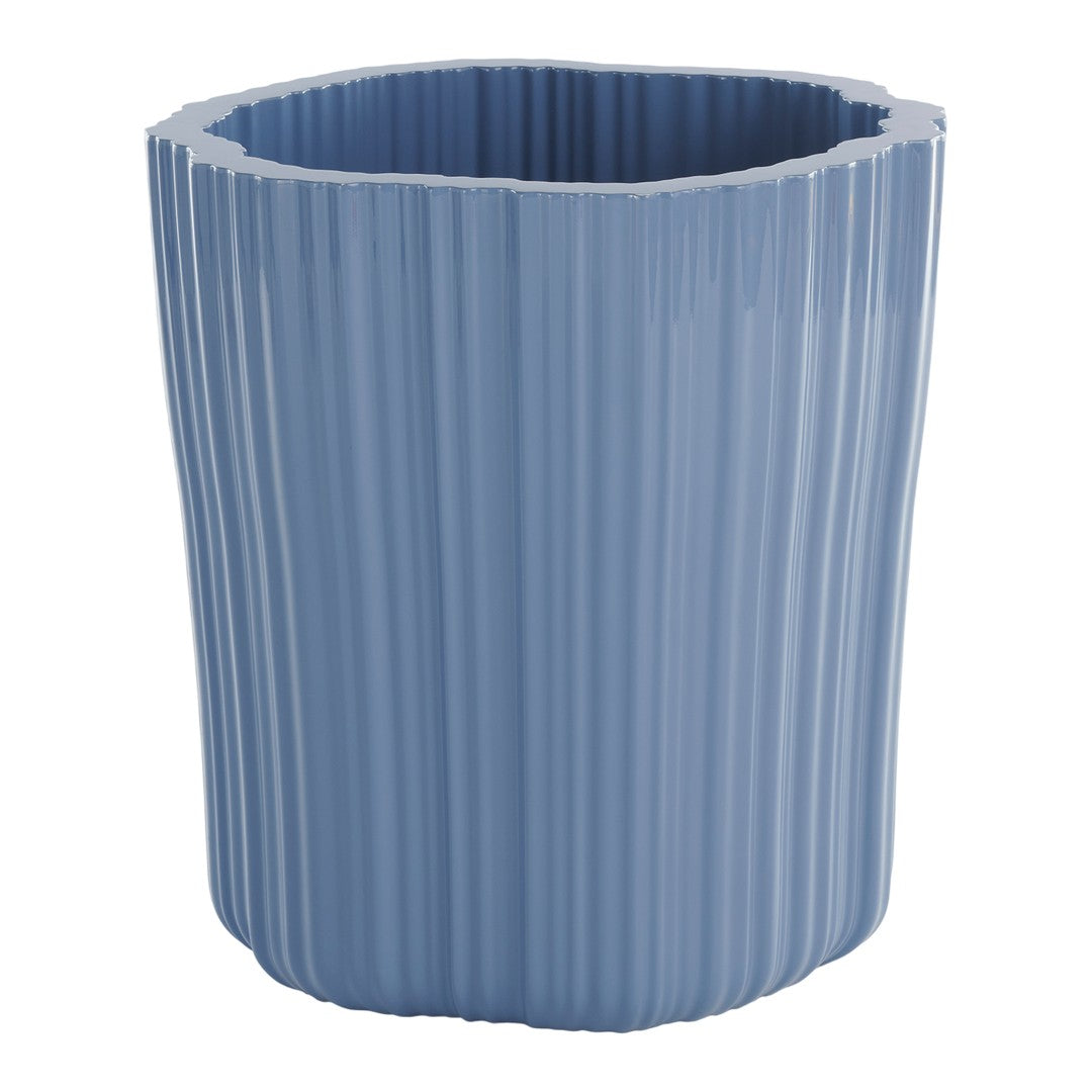 Light blue, ribbed ceramic planter with an irregular top edge, adding a modern touch to home decor.
