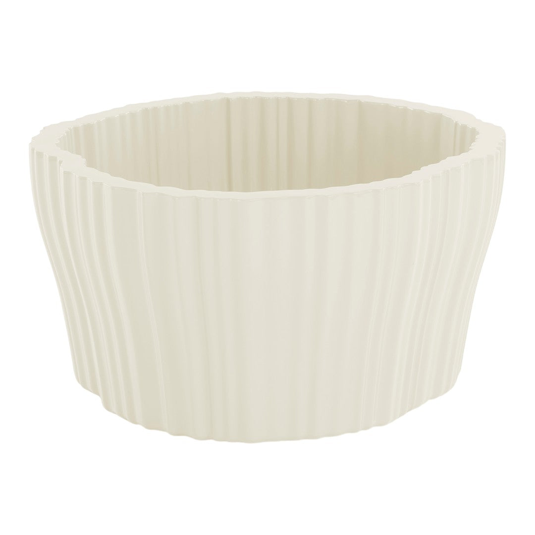 Cream-colored ribbed planter with soft, wavy texture and modern design. Ideal for indoor plants and decor.