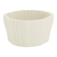 Cream-colored ribbed planter with soft, wavy texture and modern design. Ideal for indoor plants and decor.