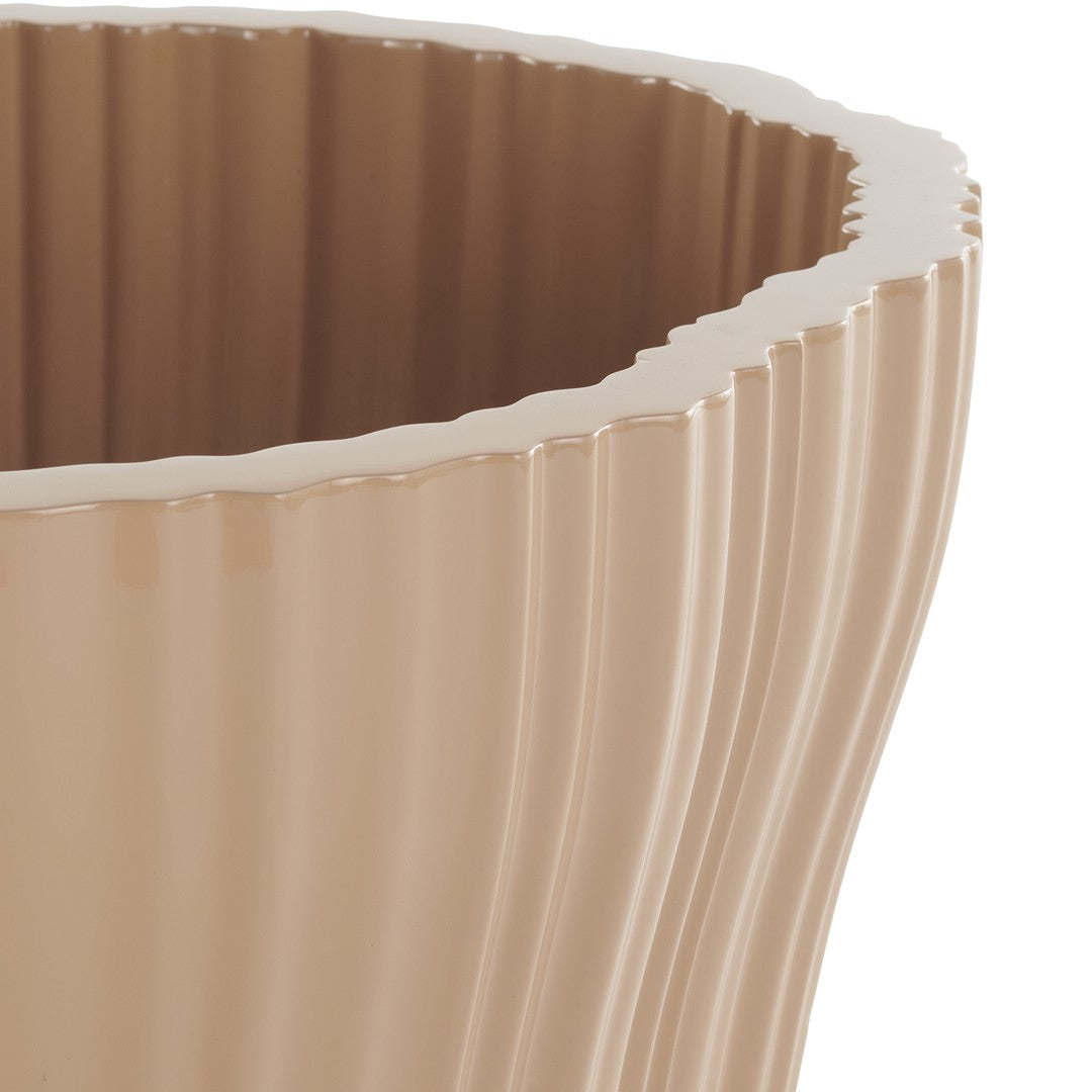 Beige ribbed planter with a wavy edge, showcasing a glossy finish and subtle texture variations. Perfect for modern decor.