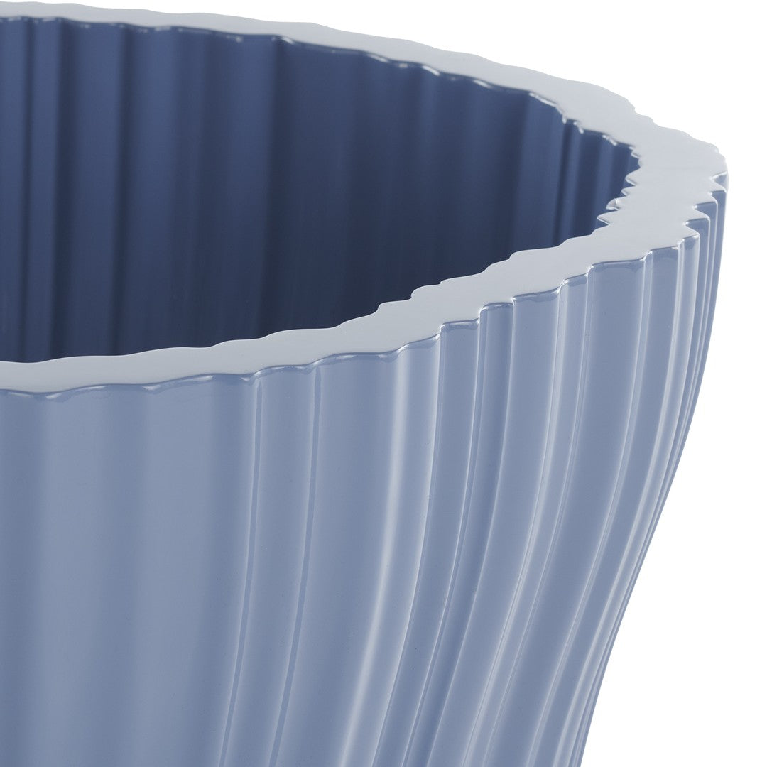Light blue ribbed planter with a wavy edge, showcasing a smooth, glossy finish and modern design.