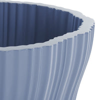 Light blue ribbed planter with a wavy edge, showcasing a smooth, glossy finish and modern design.