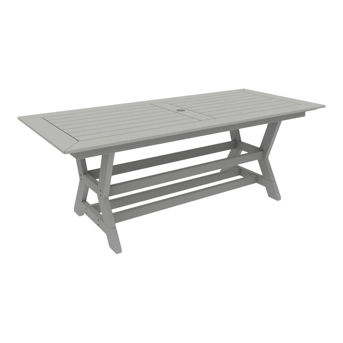 Stylish gray outdoor dining table with a slatted top and modern x-shaped legs, perfect for any patio setup.