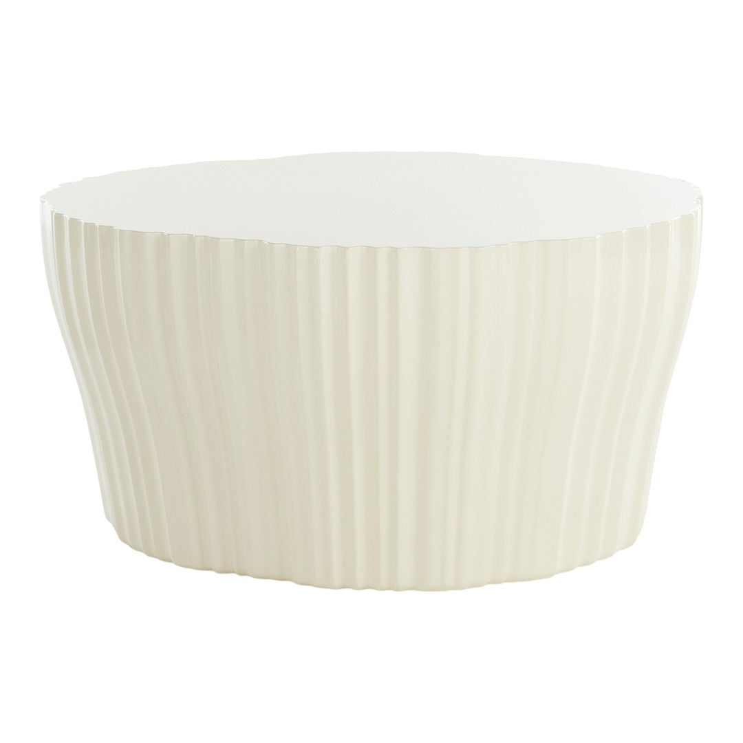 Off-white round table with vertical ribbed pattern and smooth top surface, adding elegant texture to any space.