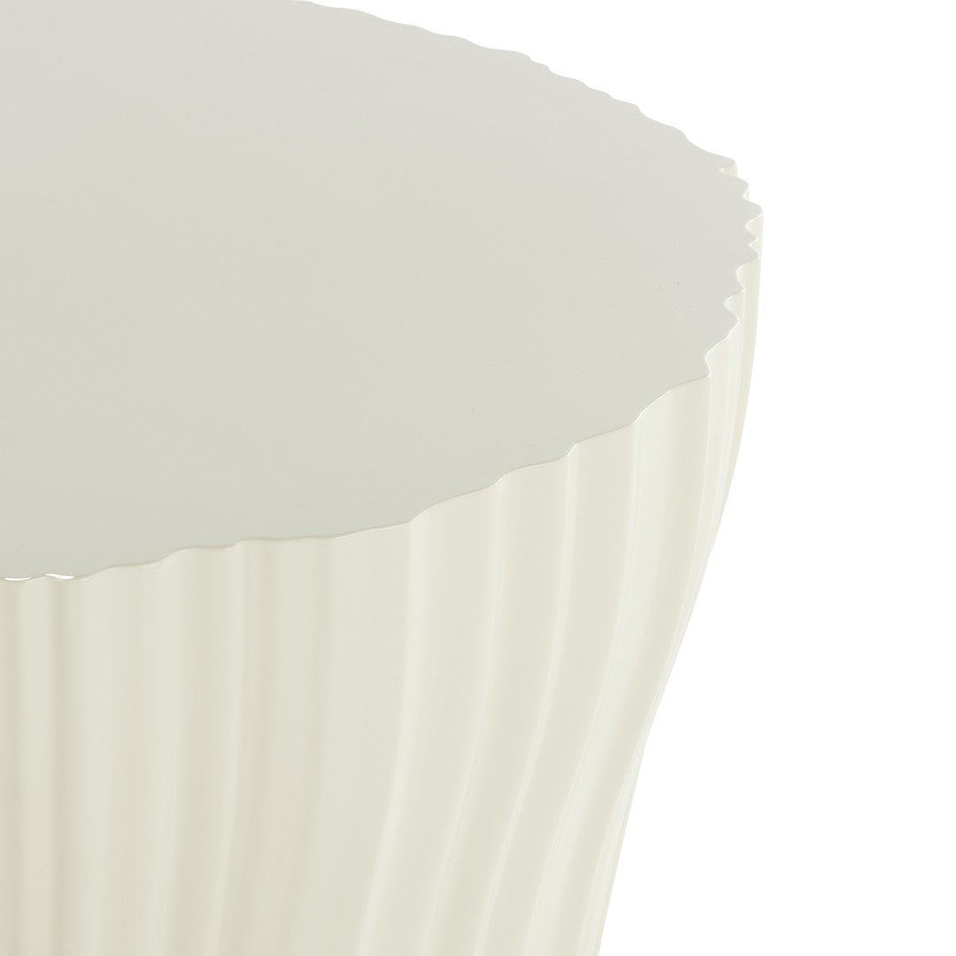 Cream-colored side table with a textured, ribbed pattern and a sleek, glossy top. Ideal for modern decor.
