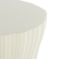 Cream-colored side table with a textured, ribbed pattern and a sleek, glossy top. Ideal for modern decor.