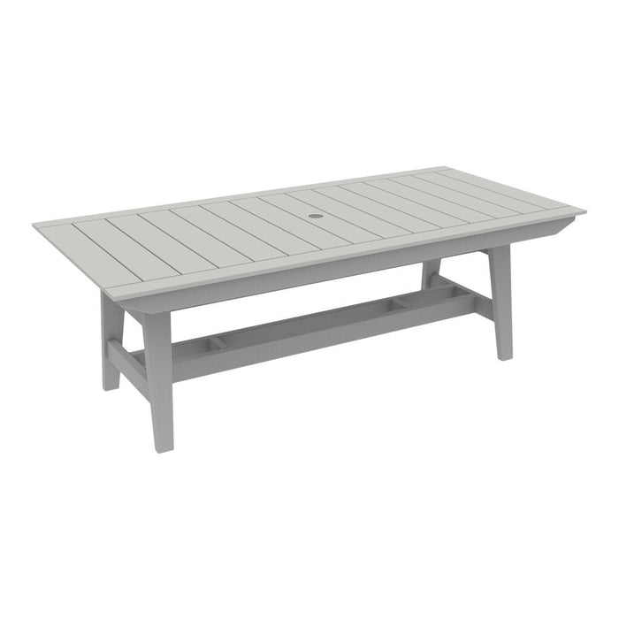 Gray rectangular outdoor table with slatted surface design and central umbrella hole. Perfect for patio setups.