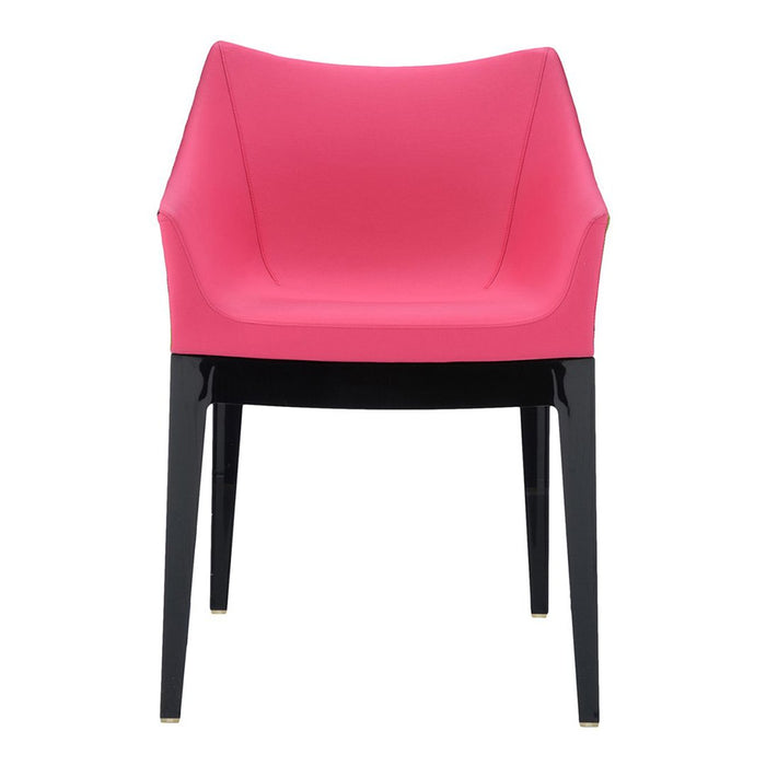 Pink modern chair with sleek, black legs and minimalistic design. Ideal for contemporary decor and vibrant spaces.