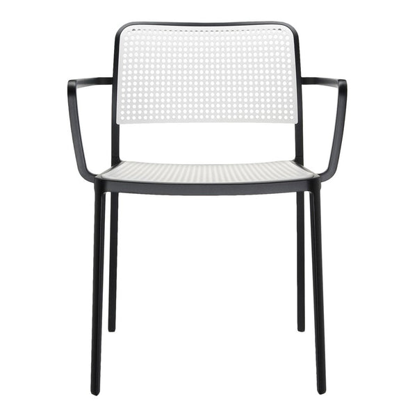 Black and white perforated chair with a sleek design and modern aesthetic. Perfect for contemporary spaces.