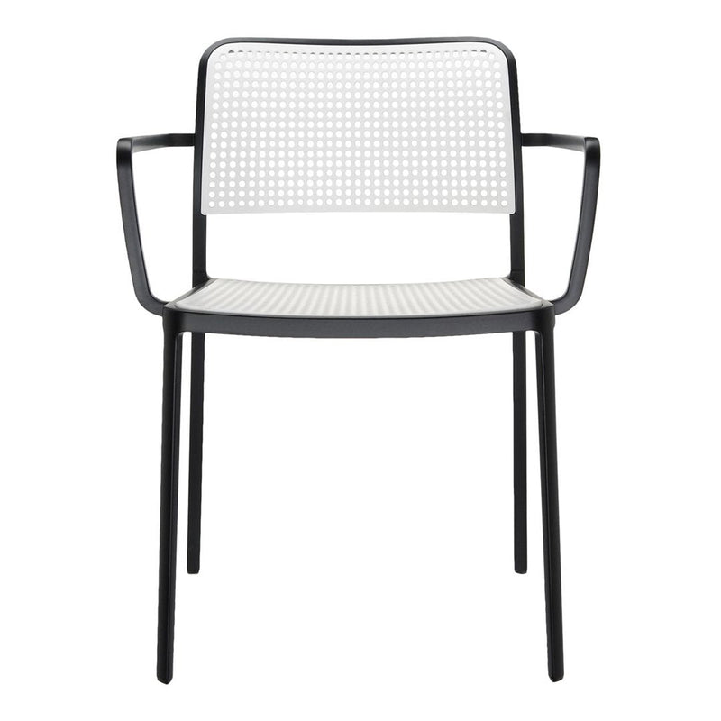 Black and white perforated chair with a sleek design and modern aesthetic. Perfect for contemporary spaces.