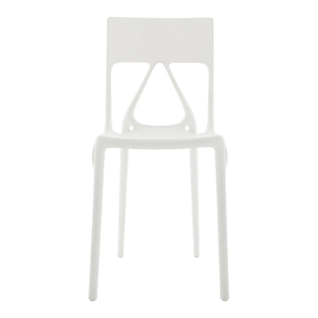 White plastic chair with a sleek design, featuring a minimalist style and smooth, glossy finish.