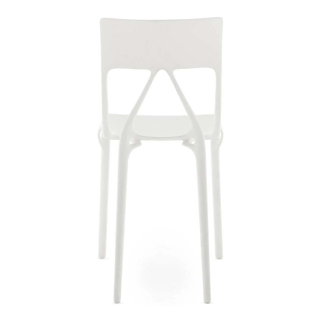 White modern chair with a sleek design, featuring a smooth finish and minimalist silhouette. Perfect for contemporary spaces.