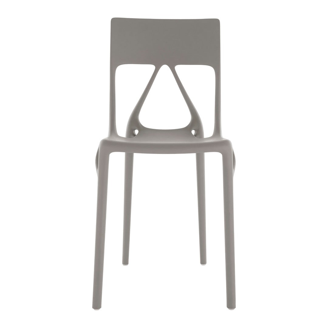 Light gray chair featuring a minimalist design with unique cutout patterns. Ideal for modern decor.