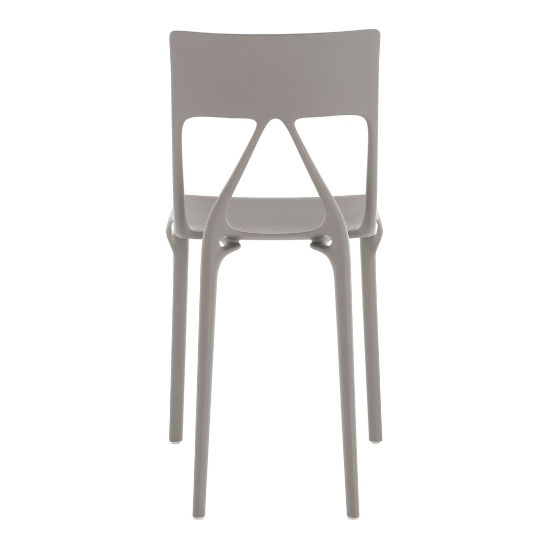 Gray plastic chair with a modern, minimalist design and smooth, clean lines. Perfect for contemporary spaces.