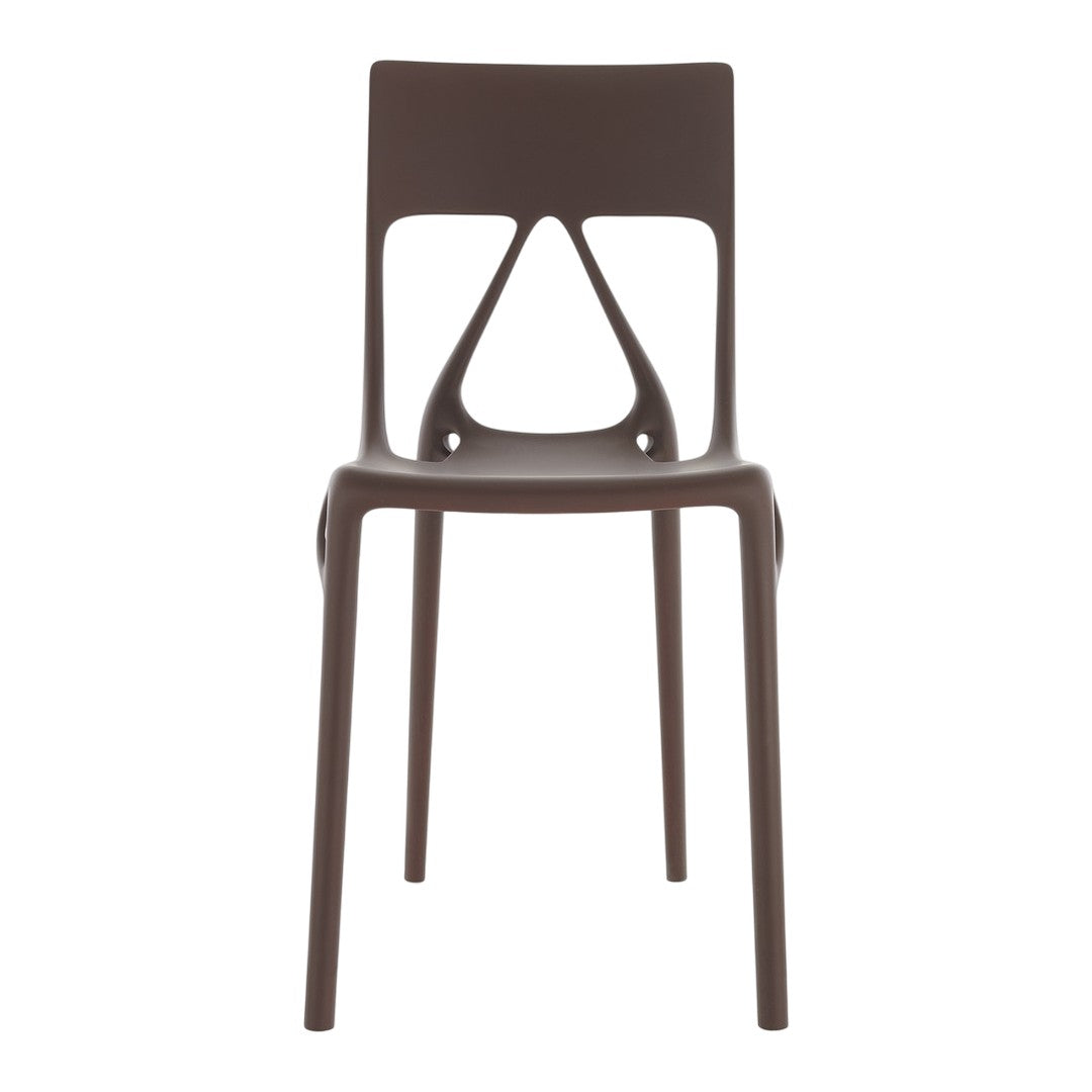 Brown molded chair with a unique cutout pattern, sleek design, perfect for modern home decor.