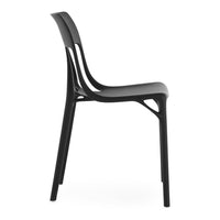 Black minimalist chair with smooth, matte finish and sleek, curved lines for a modern aesthetic.